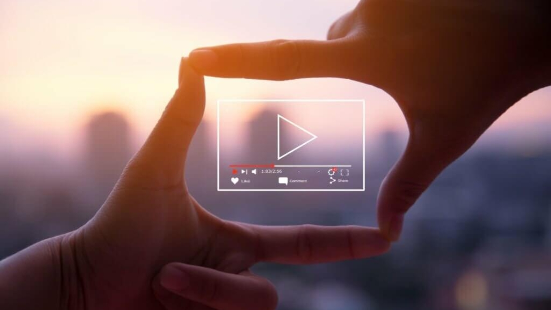 Photo sign made by human hands on blurred sunset sky as background